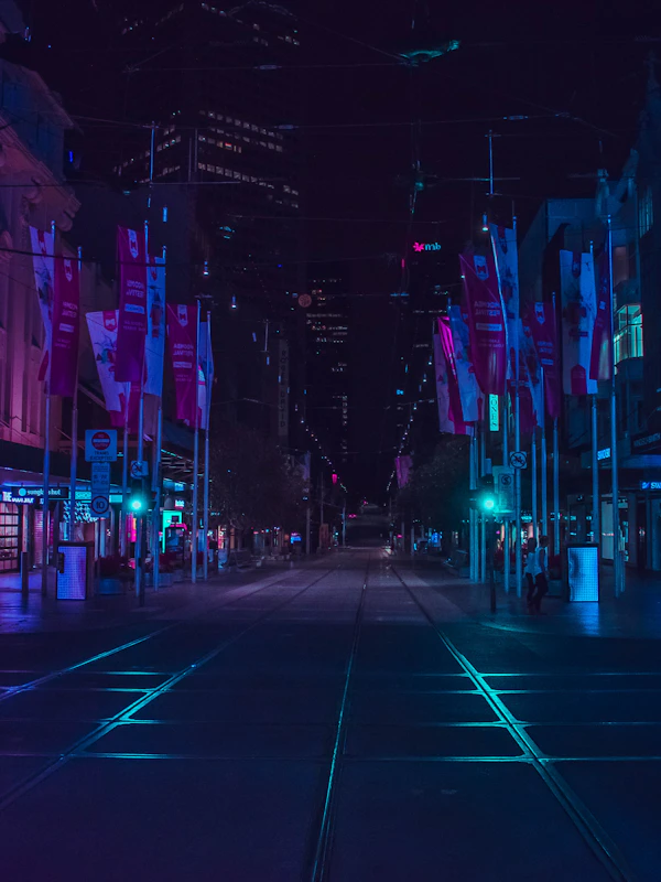 Neon-lit city street at night